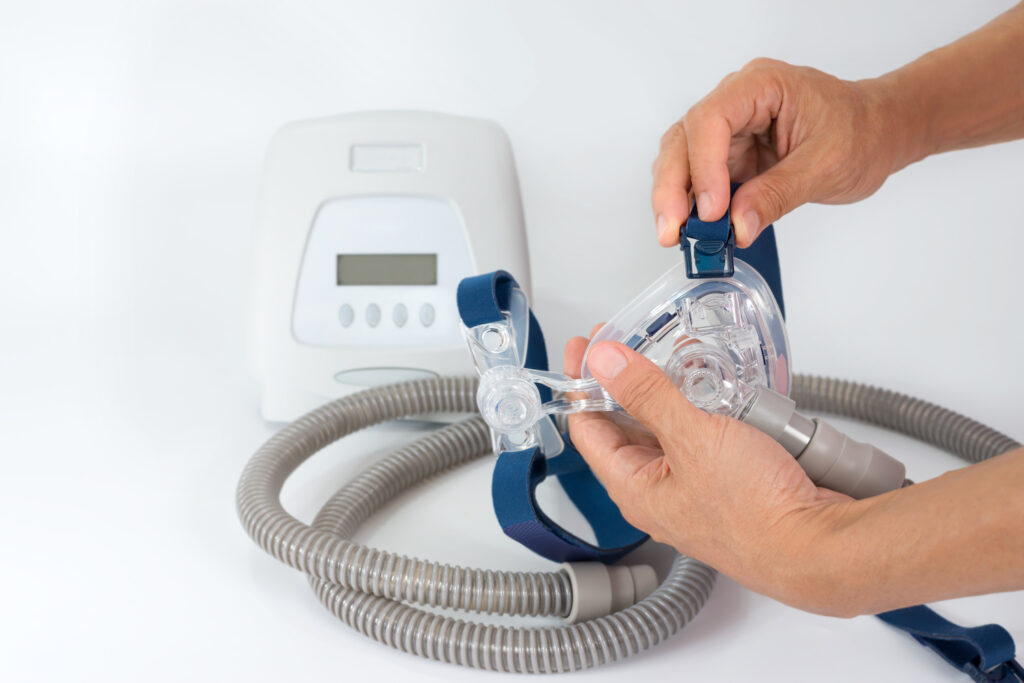 Man disassembling a cpap mask for cleaning