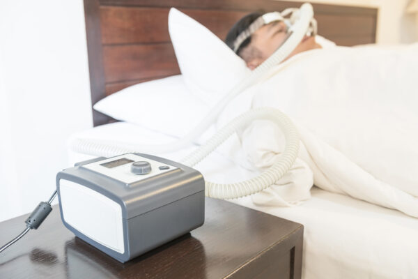 Man with a CPAP machine